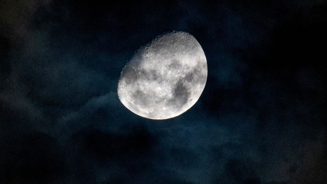 close up of a bright moon against a night sky