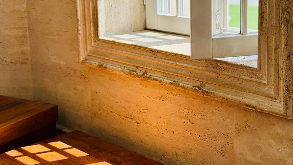 sunlit open window frame in rustic interior